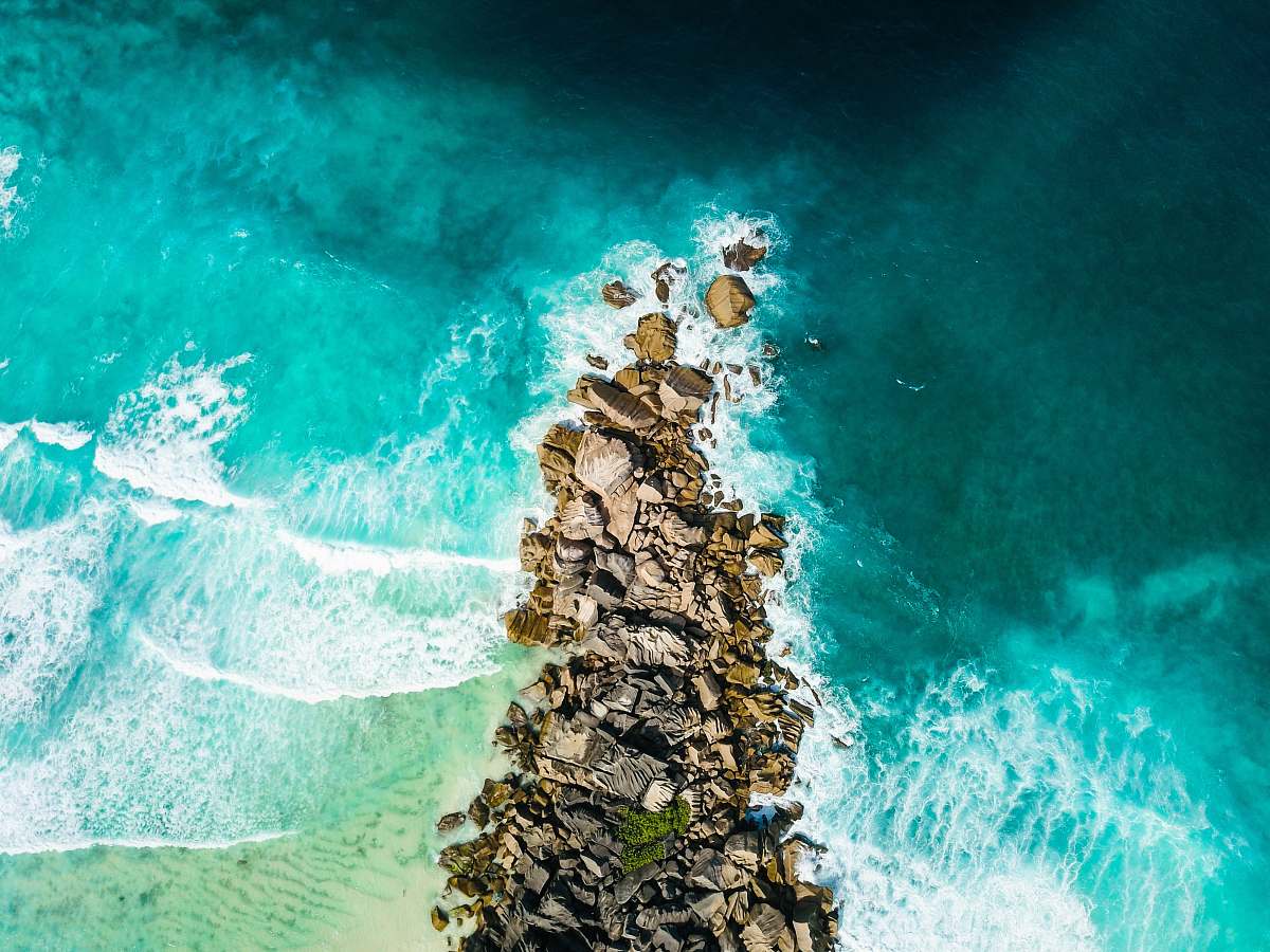 ocean aerial view of rocks near coastline sea